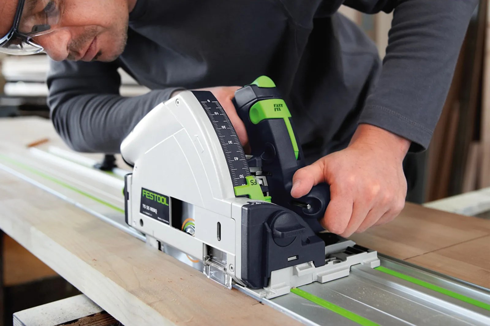 Plunge-cut saw running on an FS guide rail, close view