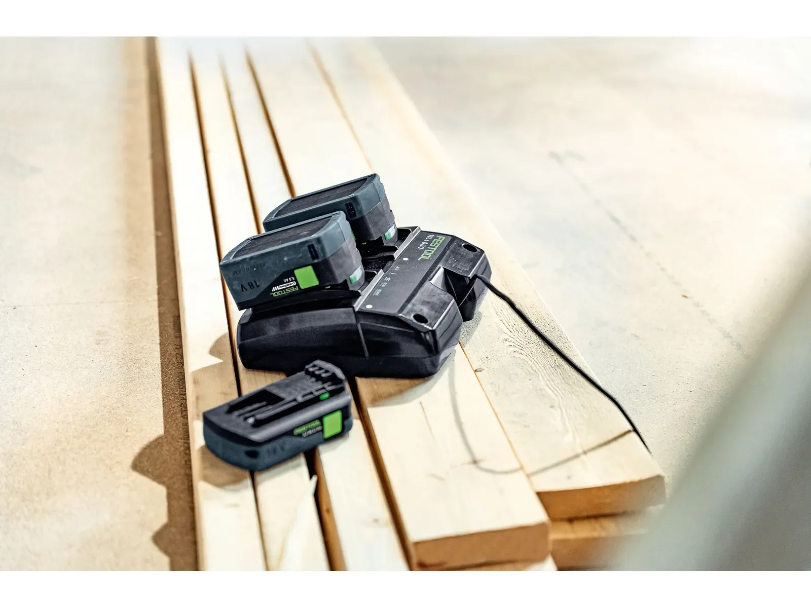 Batteries charging on the TCL 6 DUO on timber boards