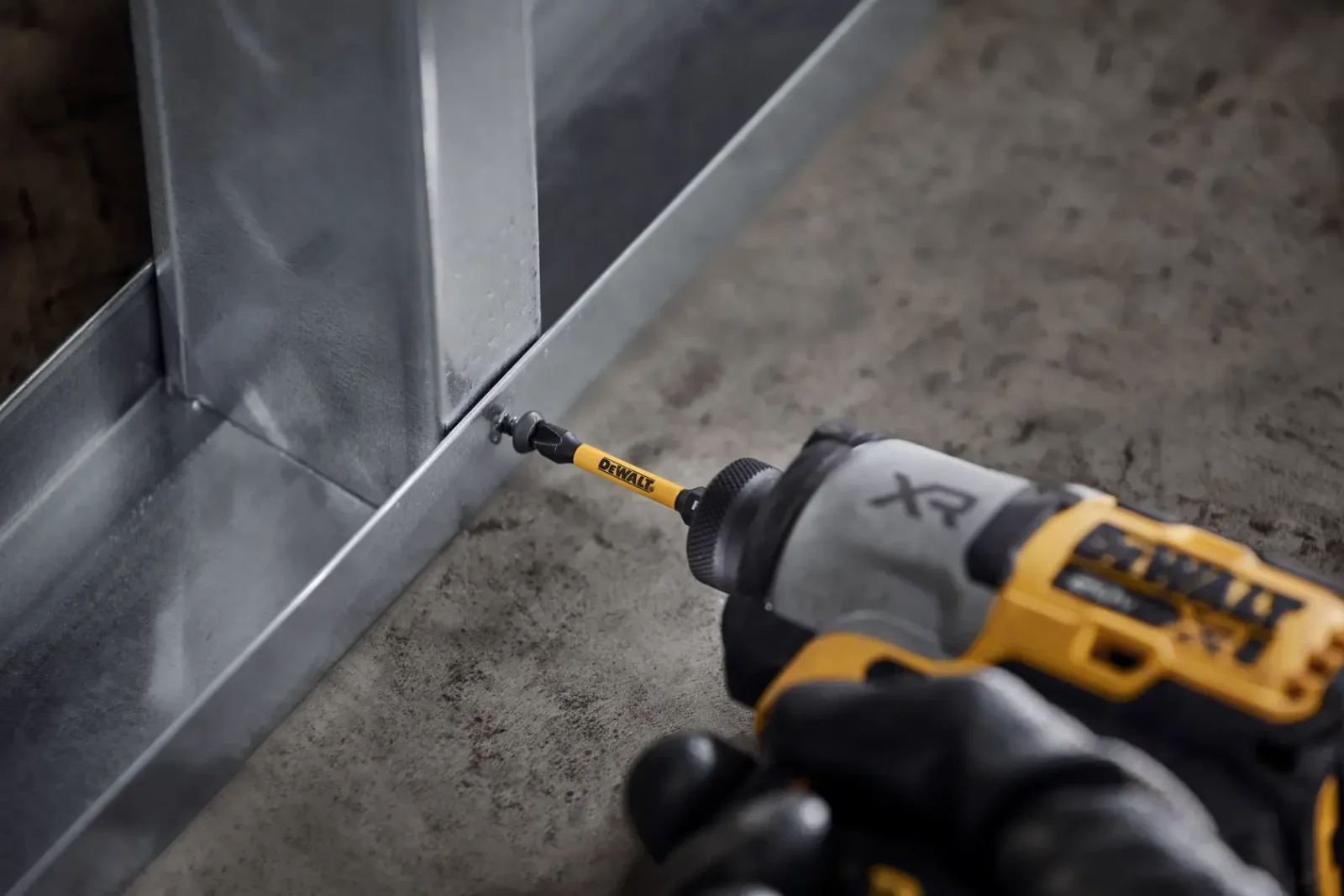 DeWalt impact driver with FlexTorq bit fixing metal stud track