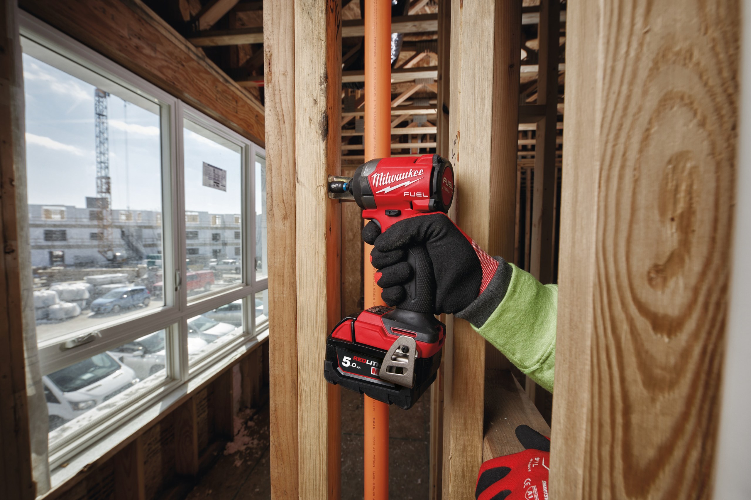 M18 FID3 FUEL 1/4″ Hex Impact Driver in use on the job