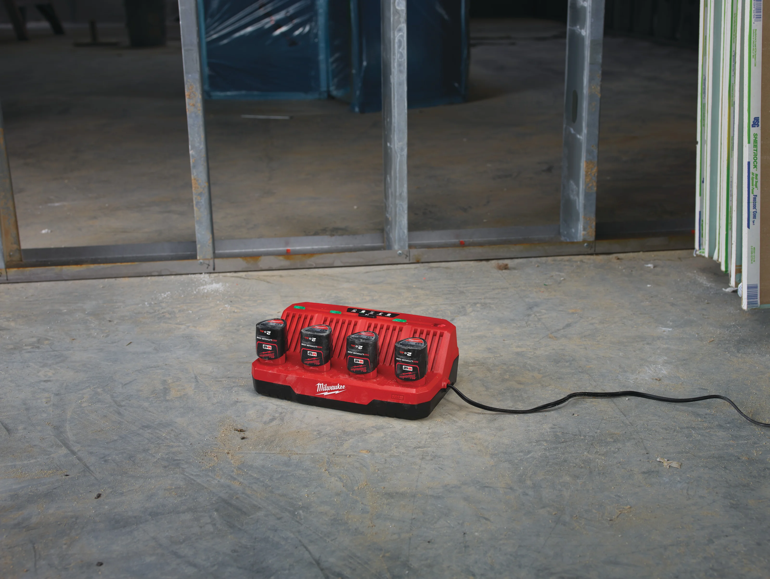 M12 C4 Four Bay Charger in use on the job