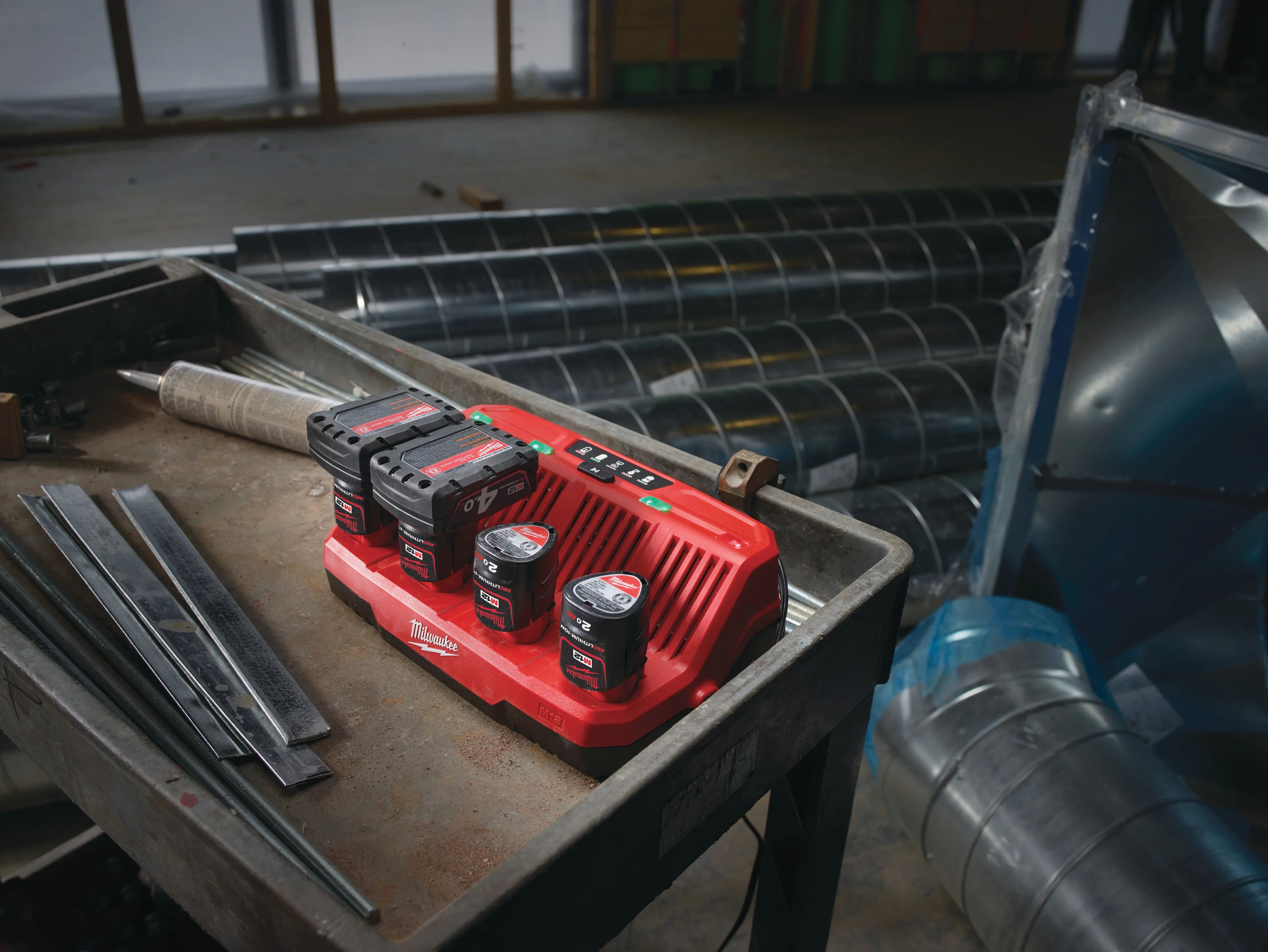 M12 C4 Four Bay Charger in use on the job