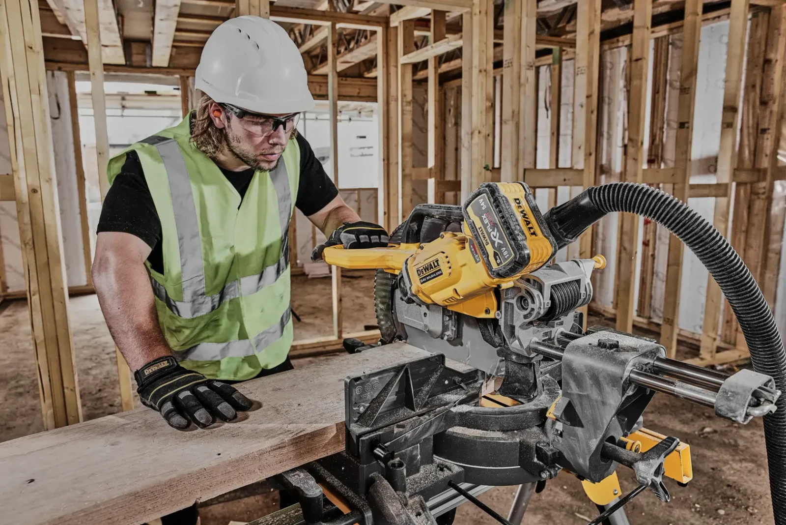 DeWalt DCS781 mitre saw in use on site