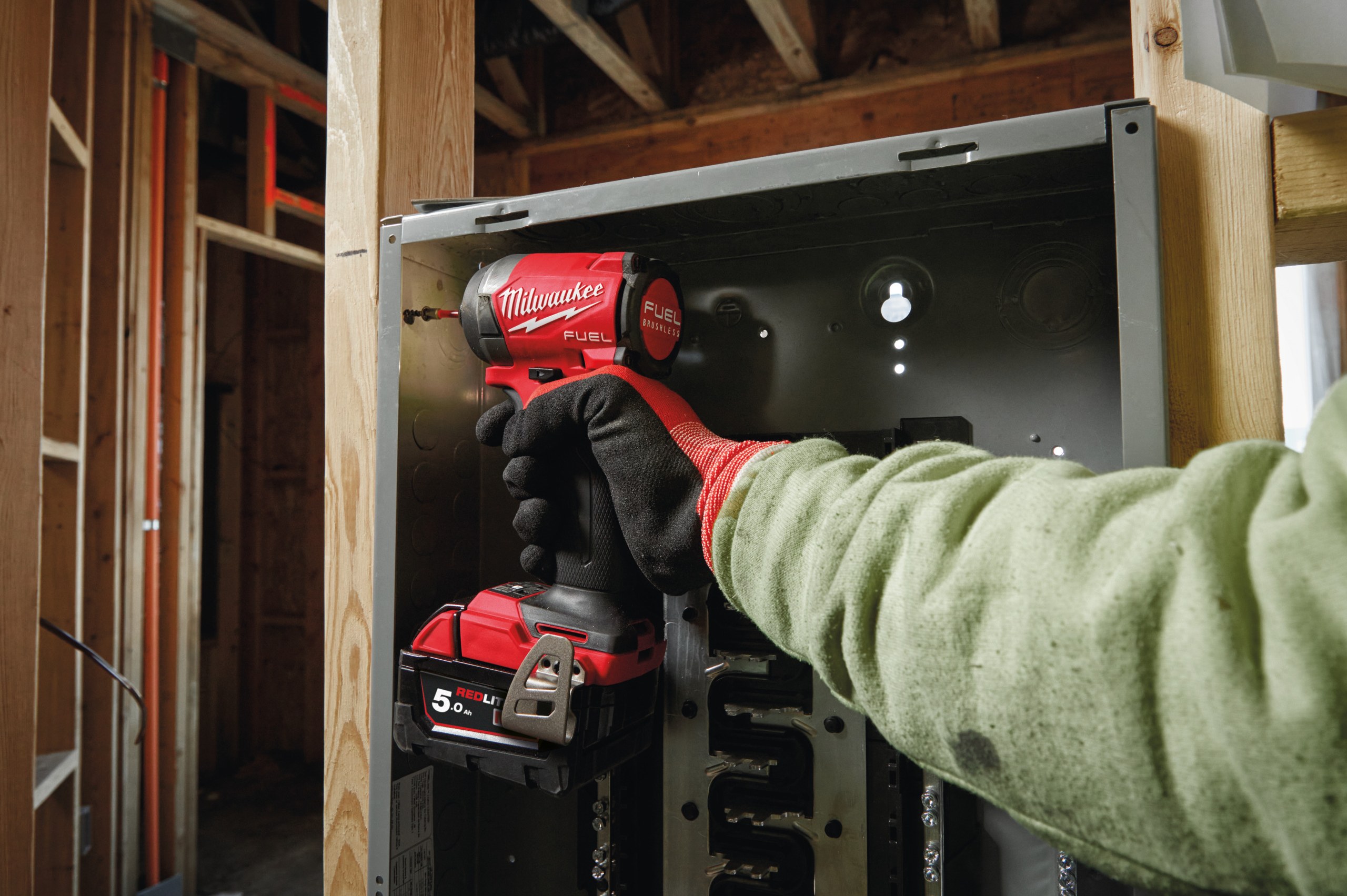 M18 FID3 FUEL 1/4″ Hex Impact Driver in use on the job