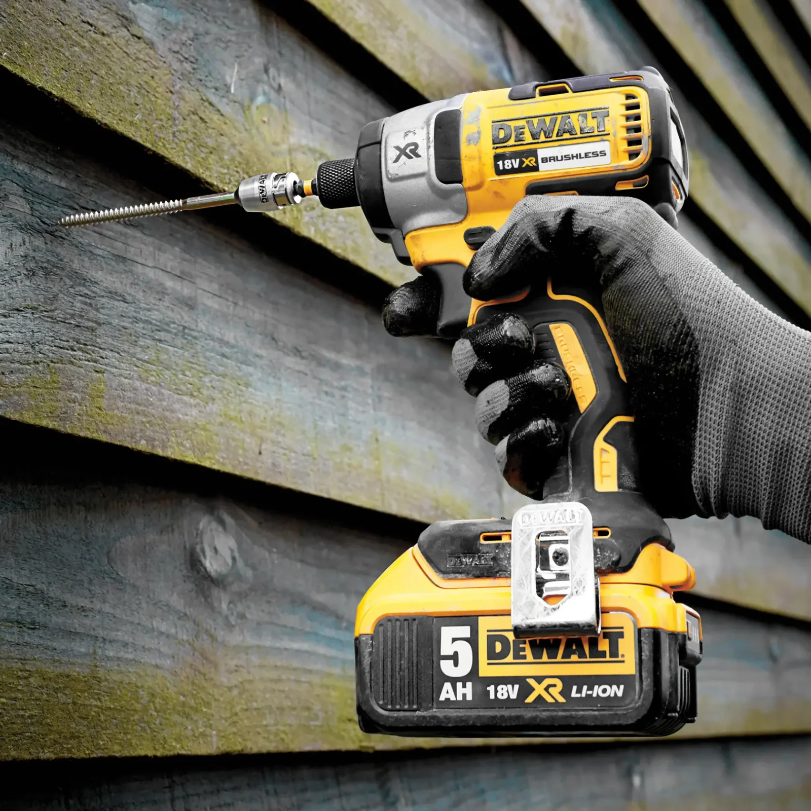 DeWalt DCF887 impact driver in use on site