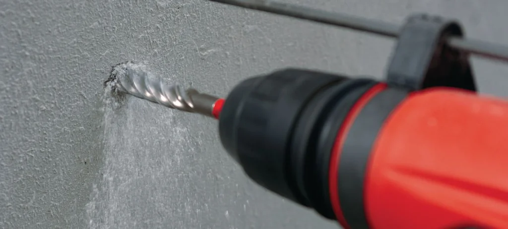 Hilti TE-CX bit drilling into concrete in a rotary hammer