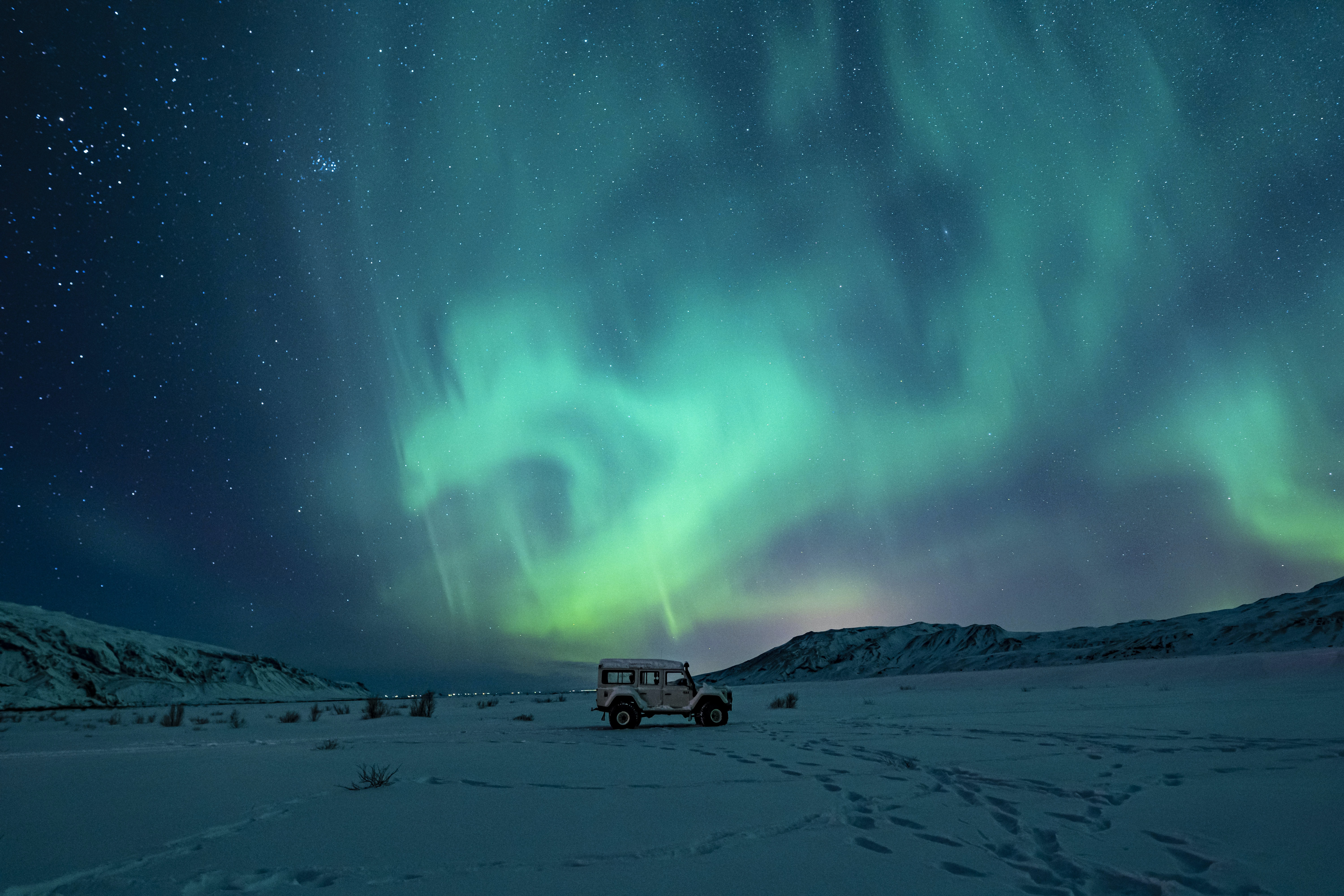 Green aurora borealis and snow.